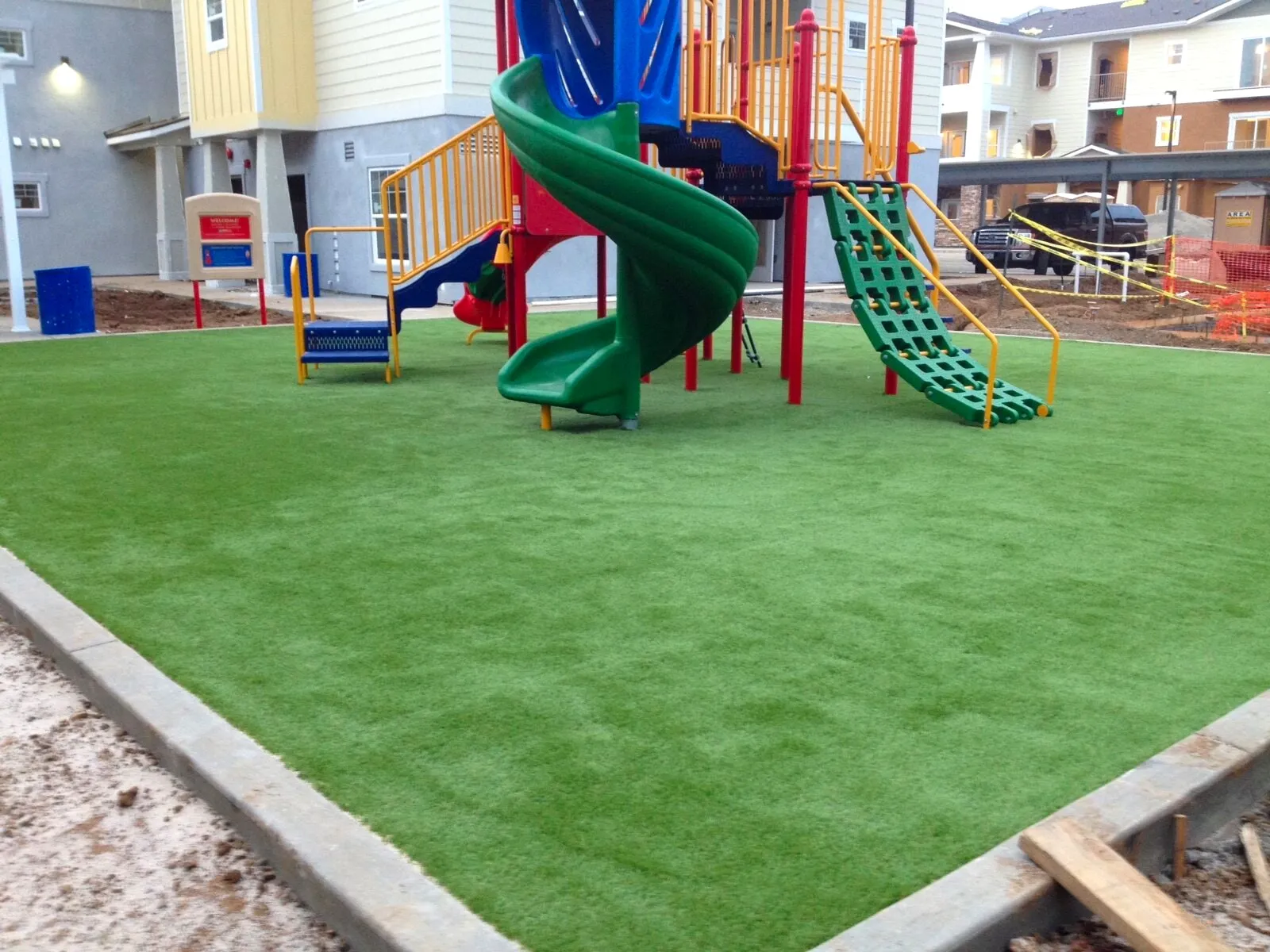 Synthetic turf installed under playground equipment